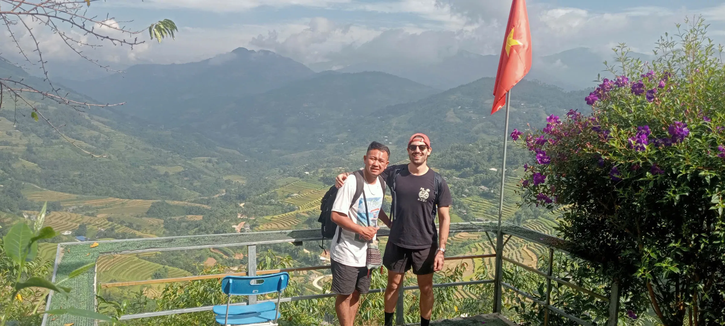 A local guide and a guest at a terrace viewpoint in Ban Luoc, western Hoang Su Phi