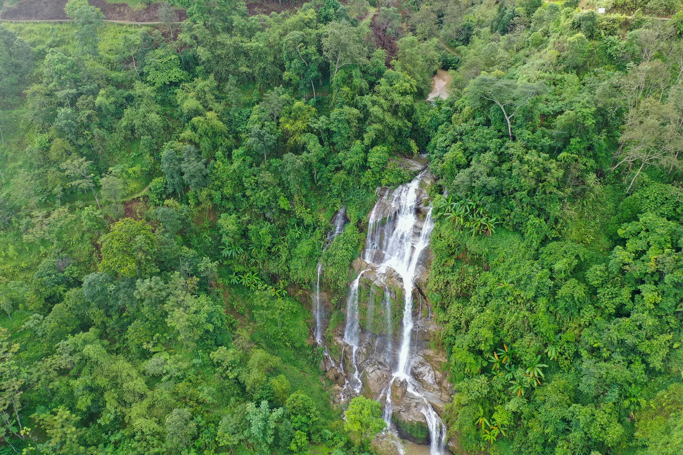 Valley and forest country in western Hoang Su Phi trekking terrain