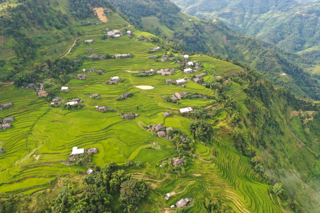 Operator field view of La Chi terraces and stilt houses above the Chay valley, Hoang Su Phi