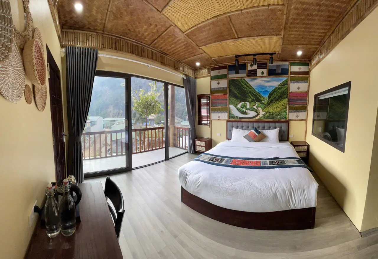 Example of a simple Dong Van area bungalow or guesthouse room — not a guaranteed property on every departure.