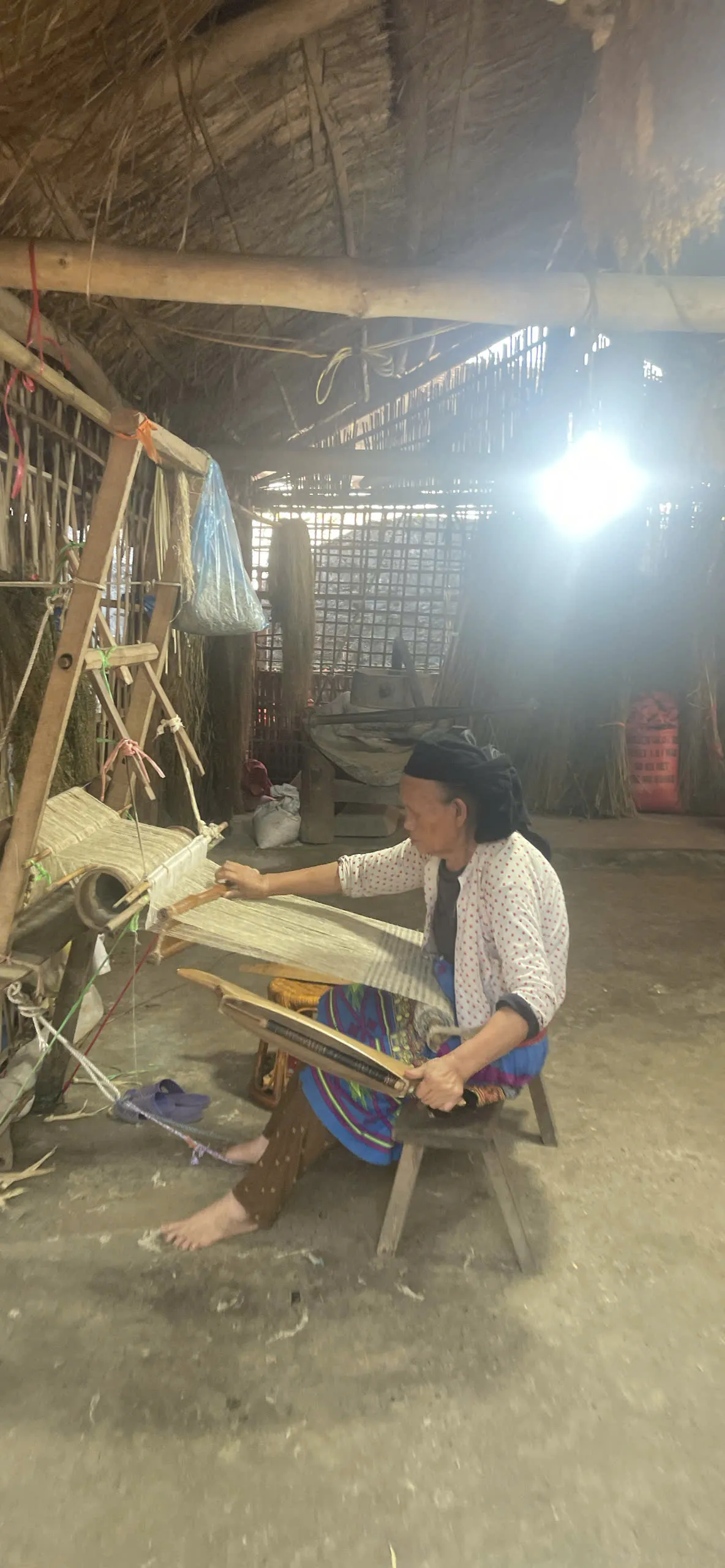 Indigo weaving work at the Lung Tam cooperative in Quan Ba — cultural context on Day 1 when route flow allows.