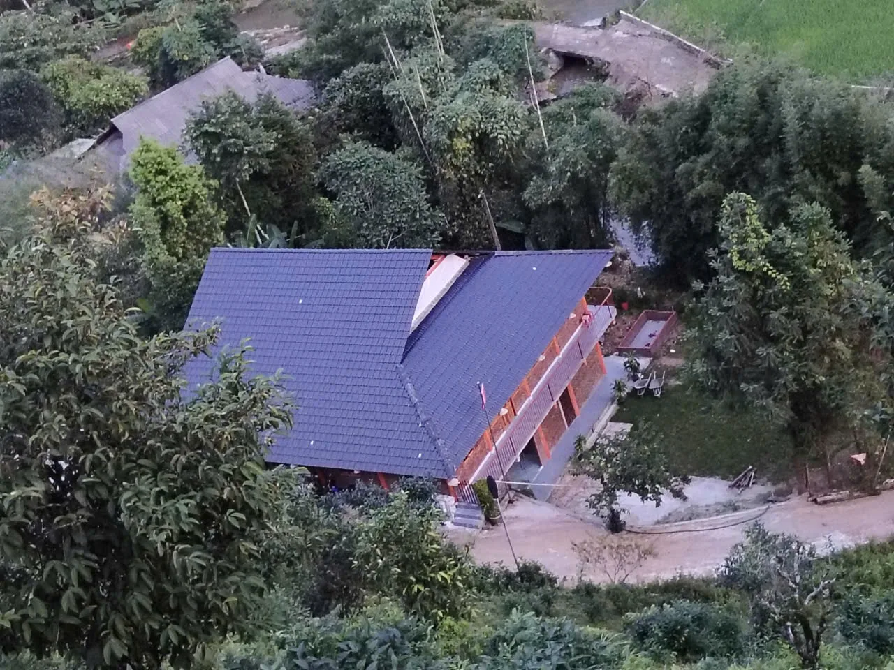 Homestay exterior in the Phin Ho area — optional post-trek context, not a standard programme night