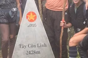 Tay Con Linh summit marker at 2,428 m when conditions allow