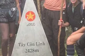Tay Con Linh summit marker showing an elevation of 2,428 metres.